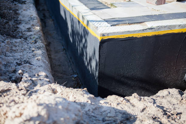 Professional Basement Waterproofing technician working in Vernon, AL